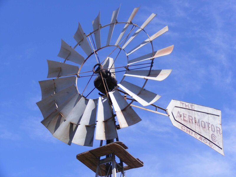 Aeromotor windmill against blue sky