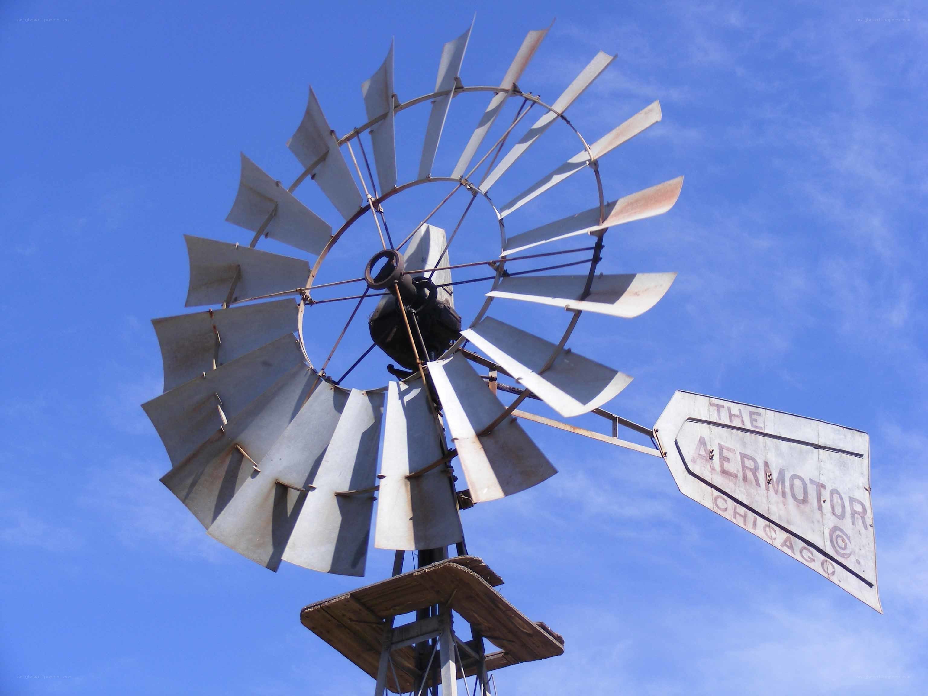 Aeromotor windmill against blue sky