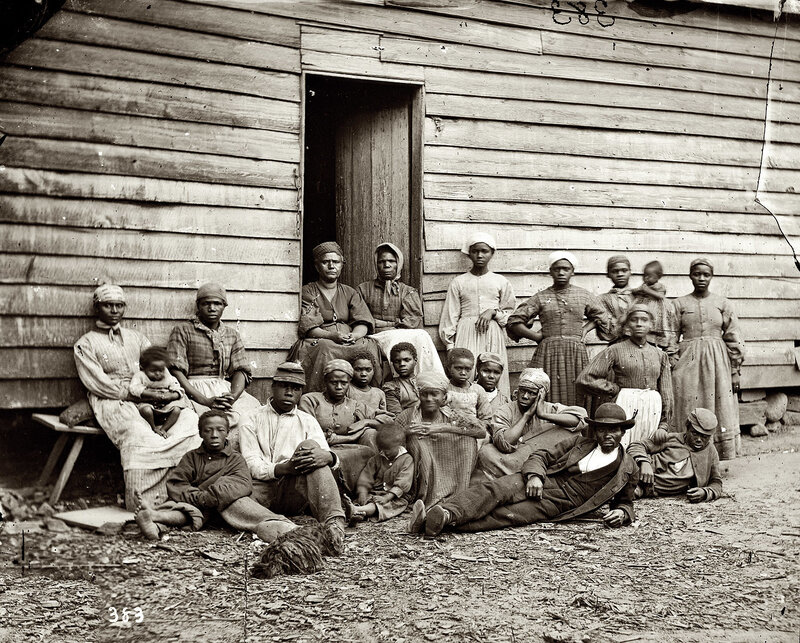 African American family in front of cabin