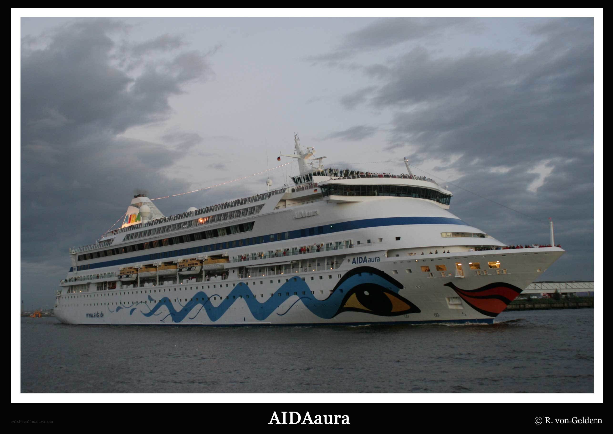 AIDAaura cruise ship at dusk