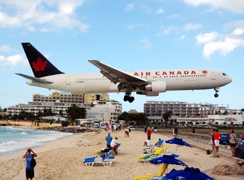 Air Canada plane landing near beach