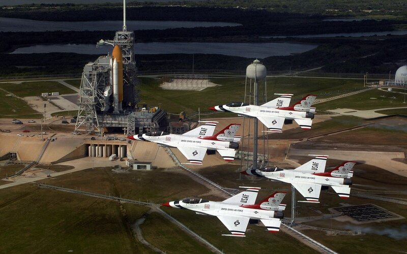 Air Force jets fly over launch pad