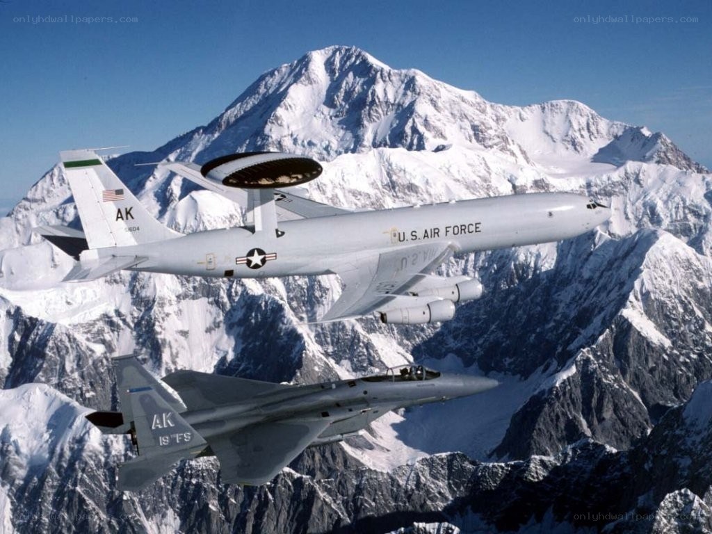 Air Force jets over snowy mountains