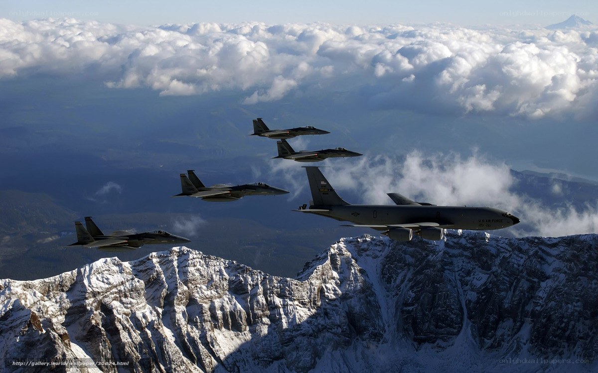 Air Force jets over snowy mountains