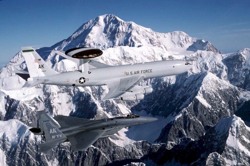 Air Force planes over snowy mountains
