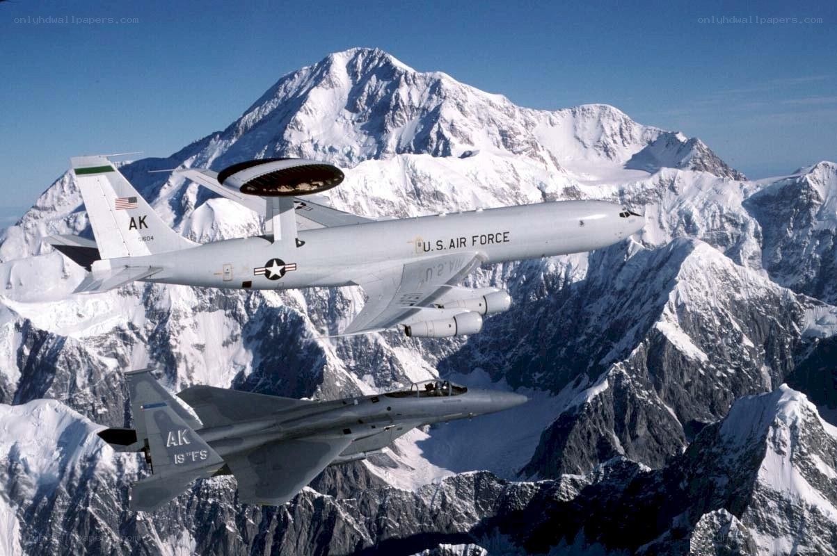 Air Force planes over snowy mountains