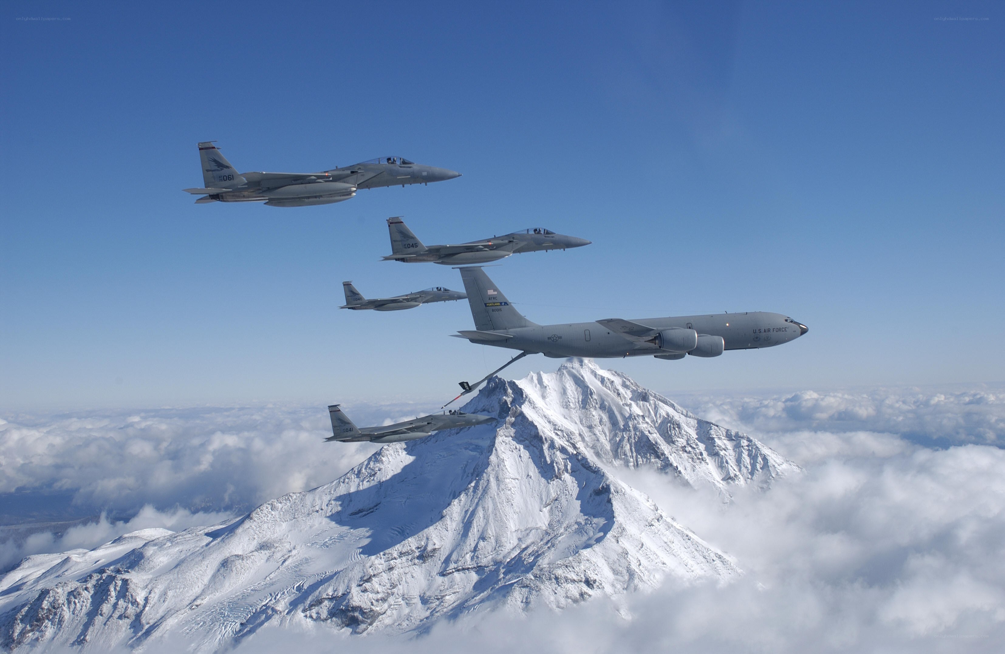 Air refueling over snowy mountain