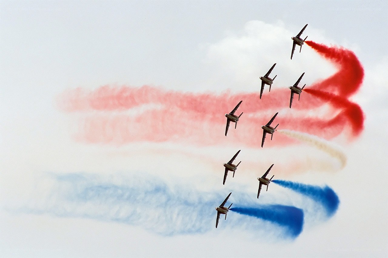 air show with colored smoke