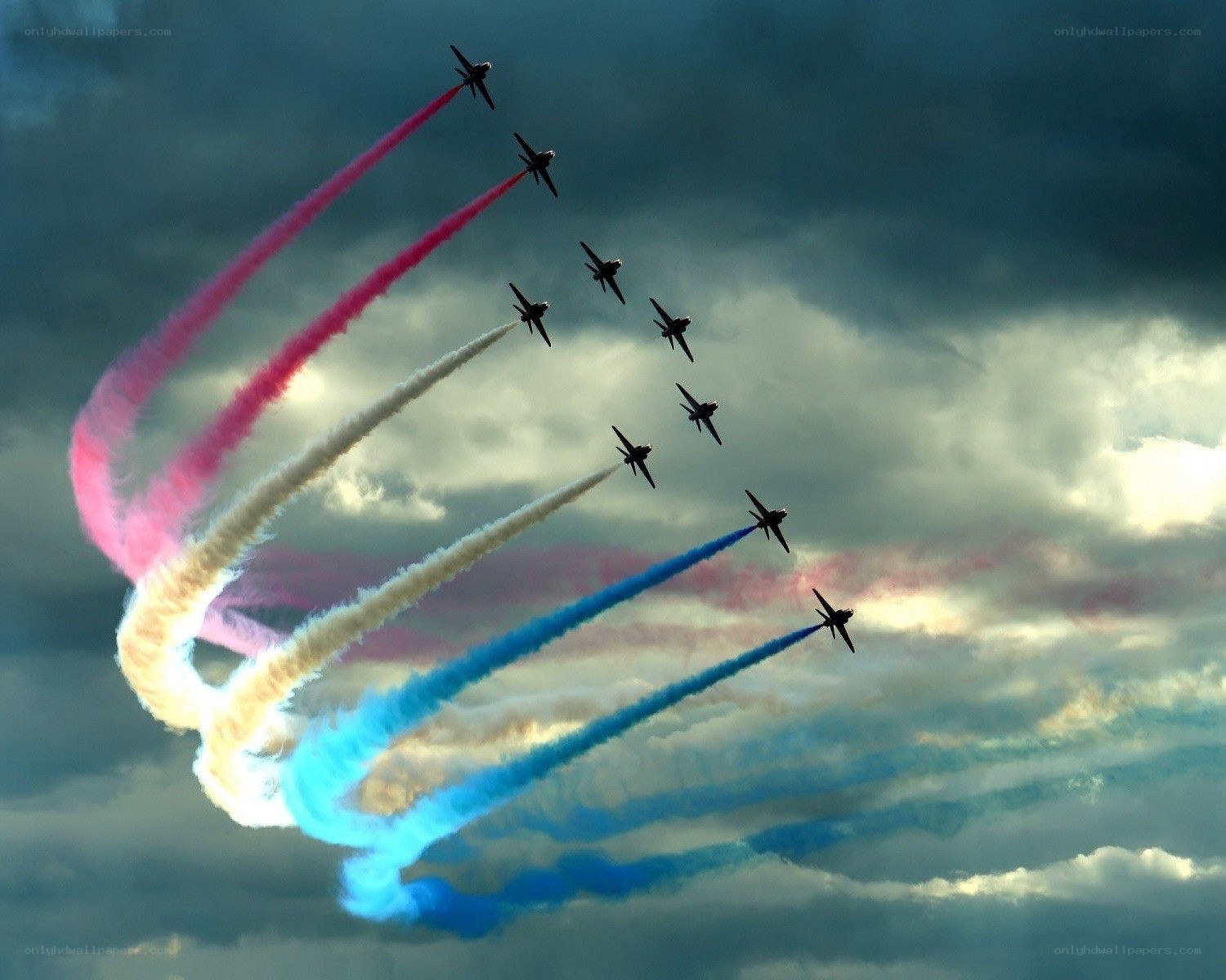 air show with colored smoke trails