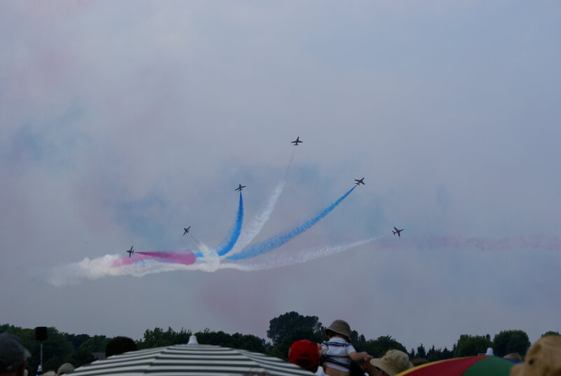 Air show with jets and smoke