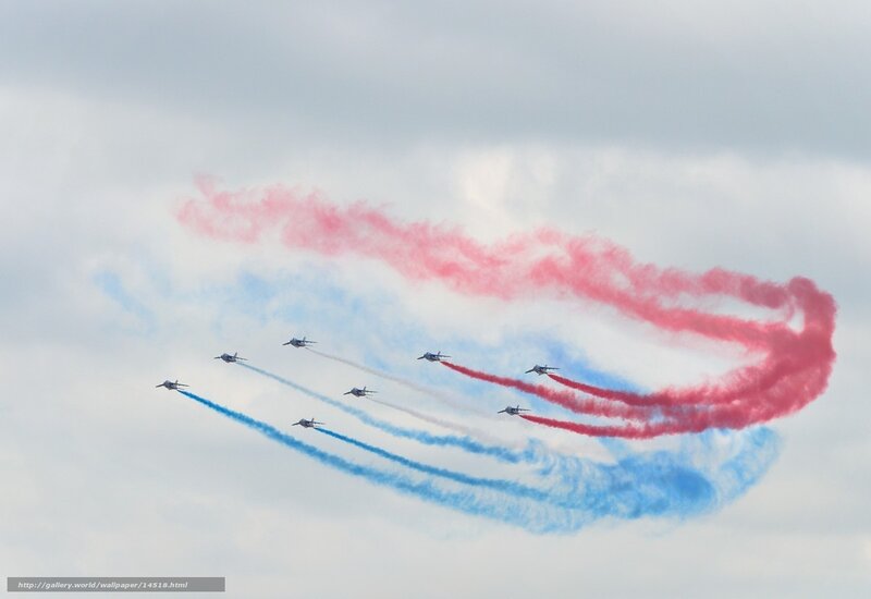 Air show with red, white, and blue smoke