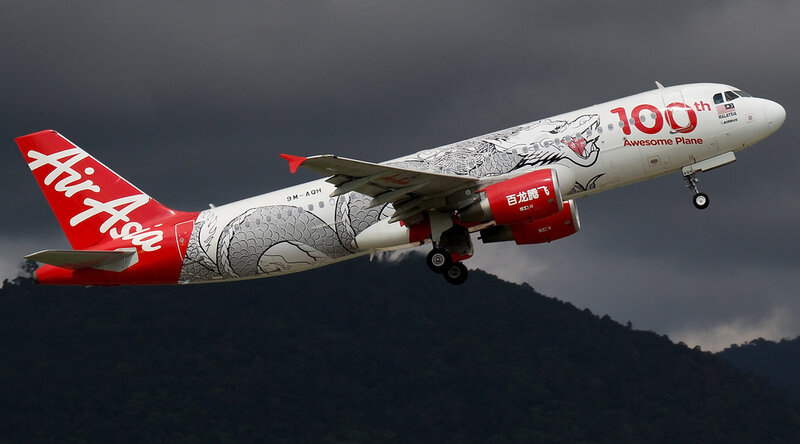 Airasia Airplane in Flight — White