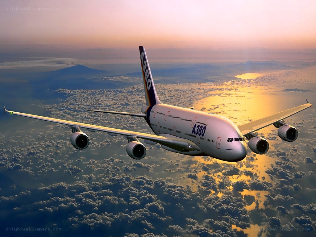 Airbus A380 flying above clouds