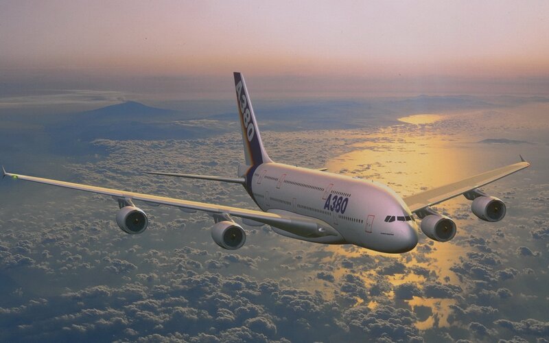 Airbus A380 flying above clouds