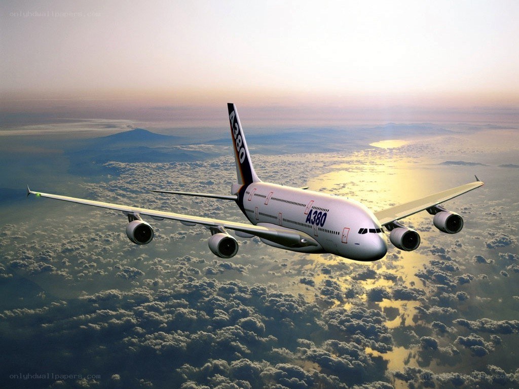 Airbus A380 flying above clouds