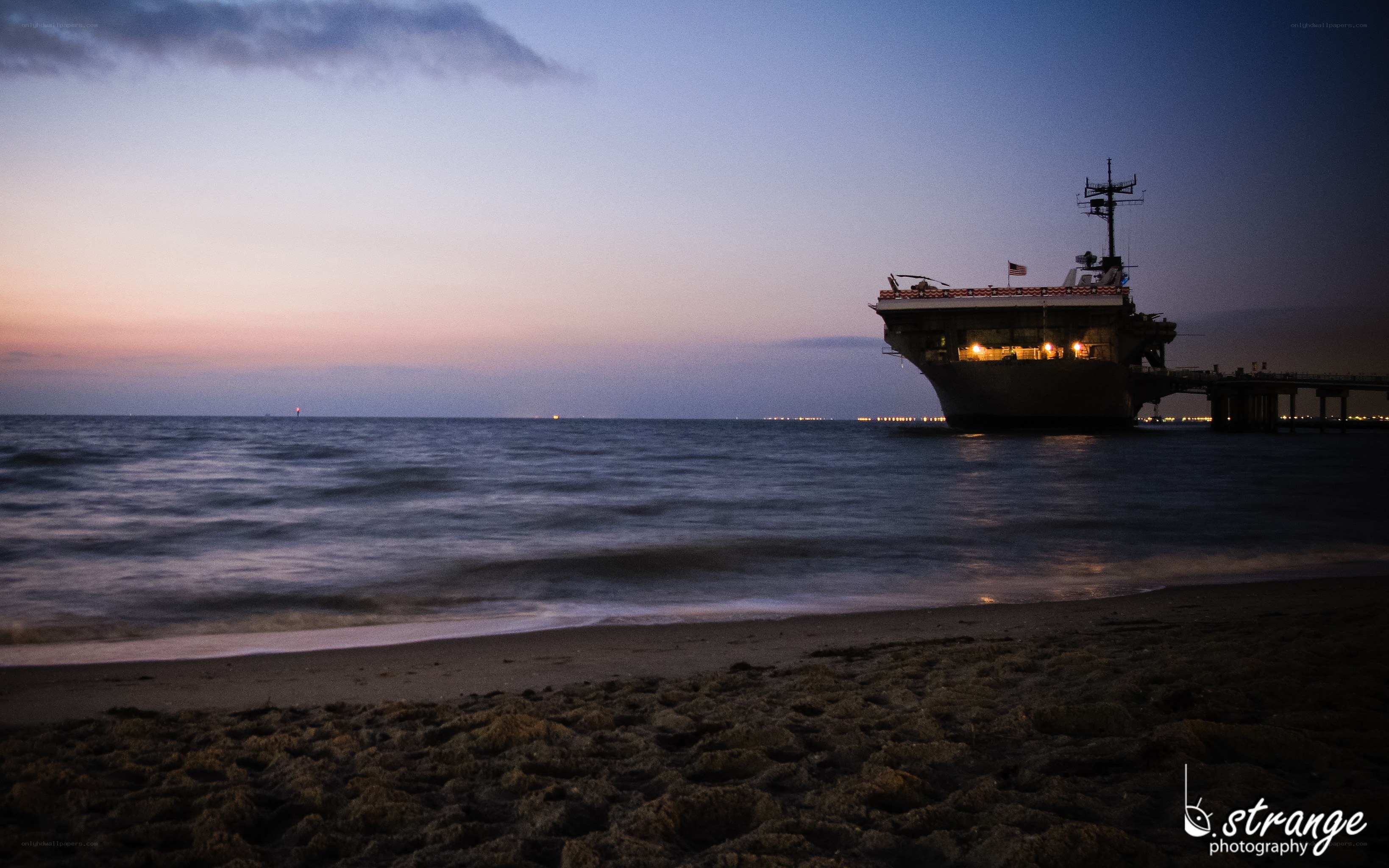 aircraft carrier at dusk