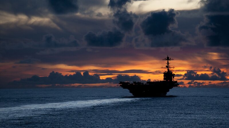 Aircraft Carrier at Sea — Blue, Dramatic, Sunset, Photograph, Ocean, Sky, Clouds, Orange