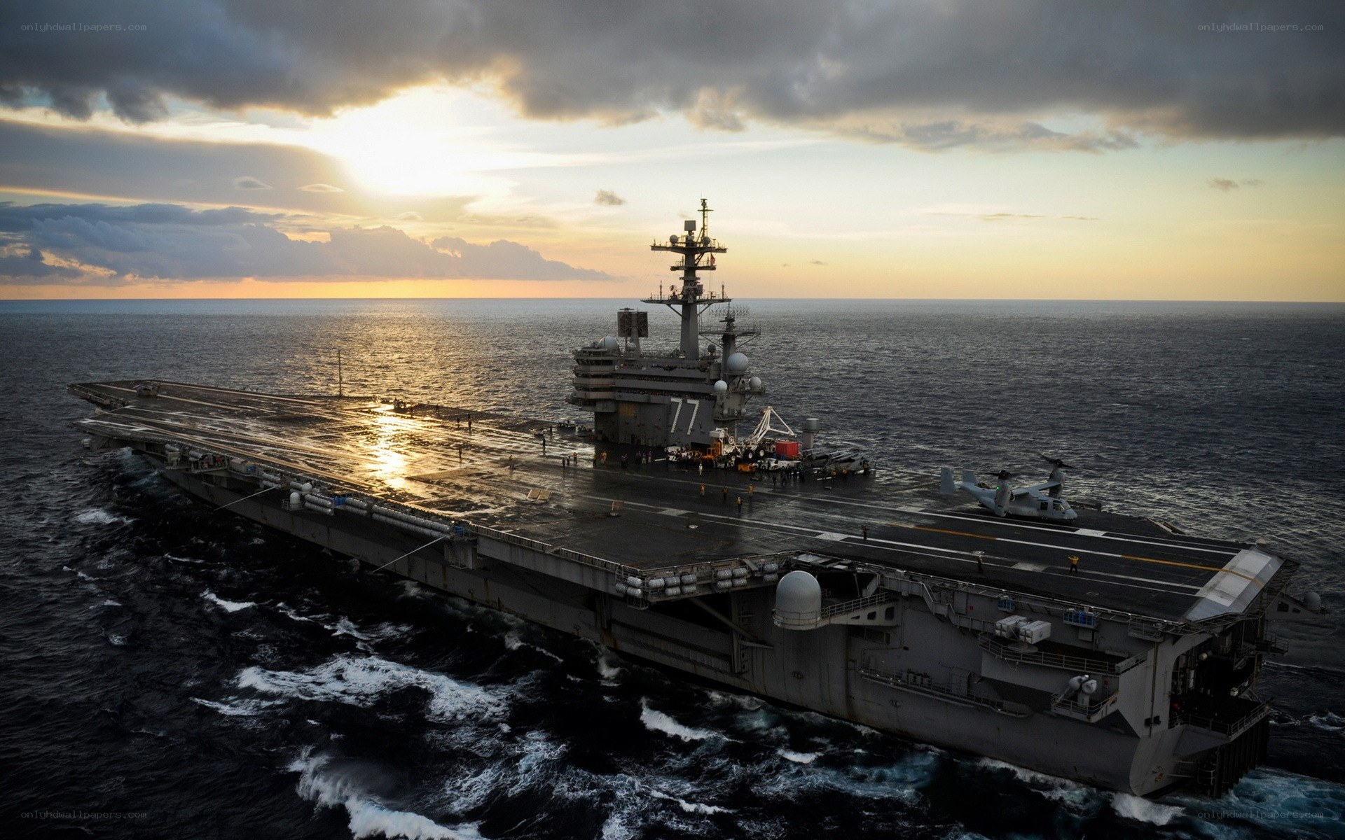 Aircraft carrier at sunset