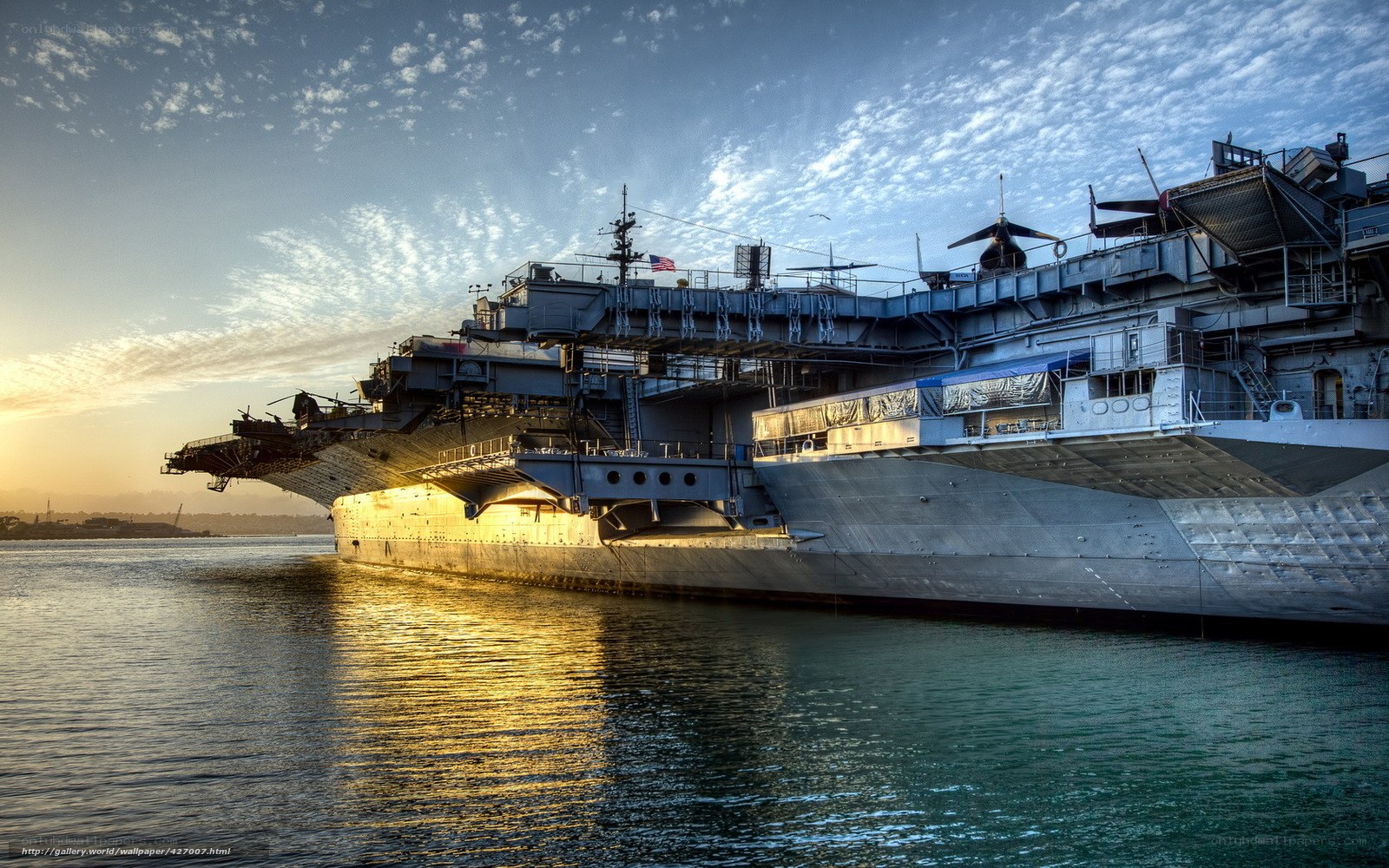Aircraft carrier at sunset