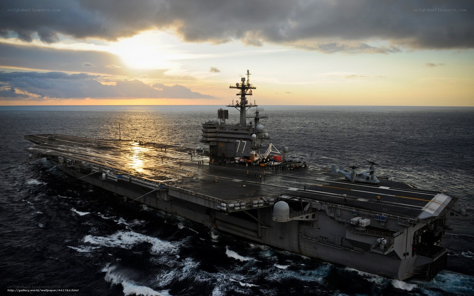 Aircraft carrier at sunset