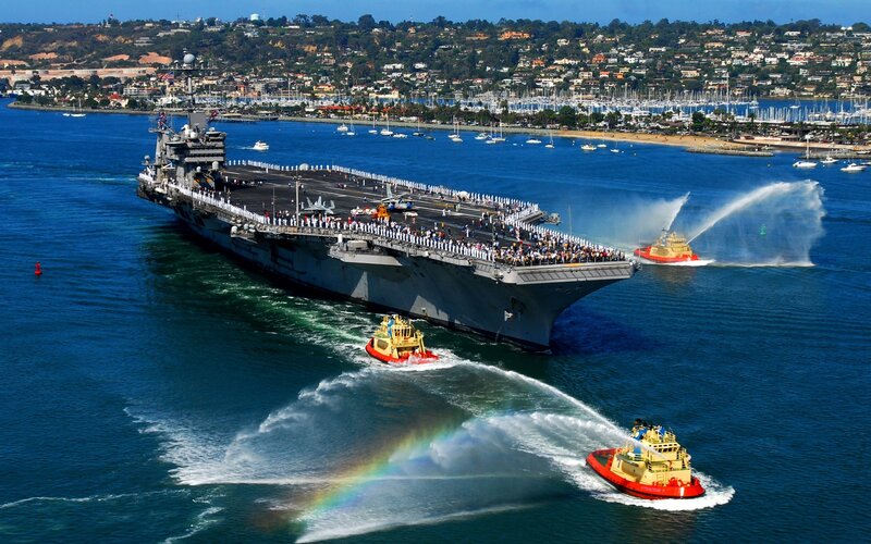 Aircraft carrier entering port