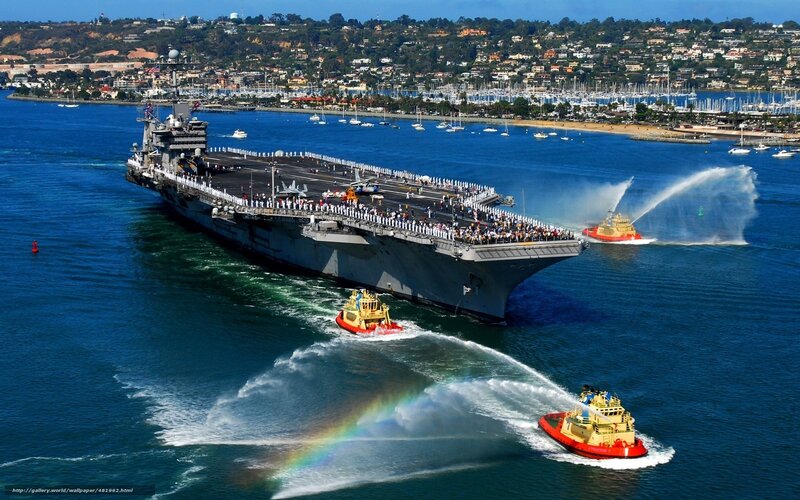 Aircraft carrier entering port