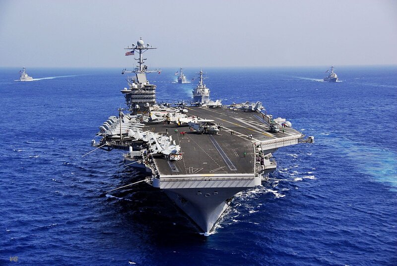 Aircraft carrier in formation at sea