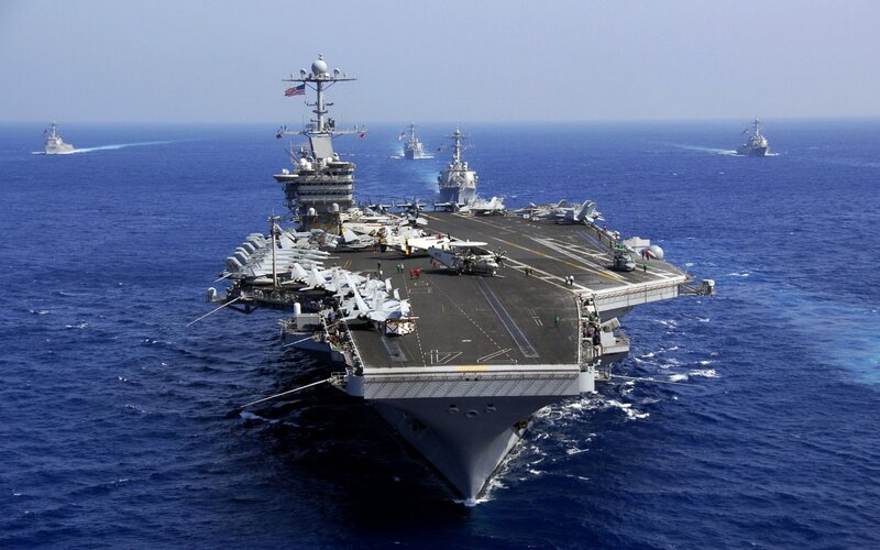 Aircraft carrier in formation at sea