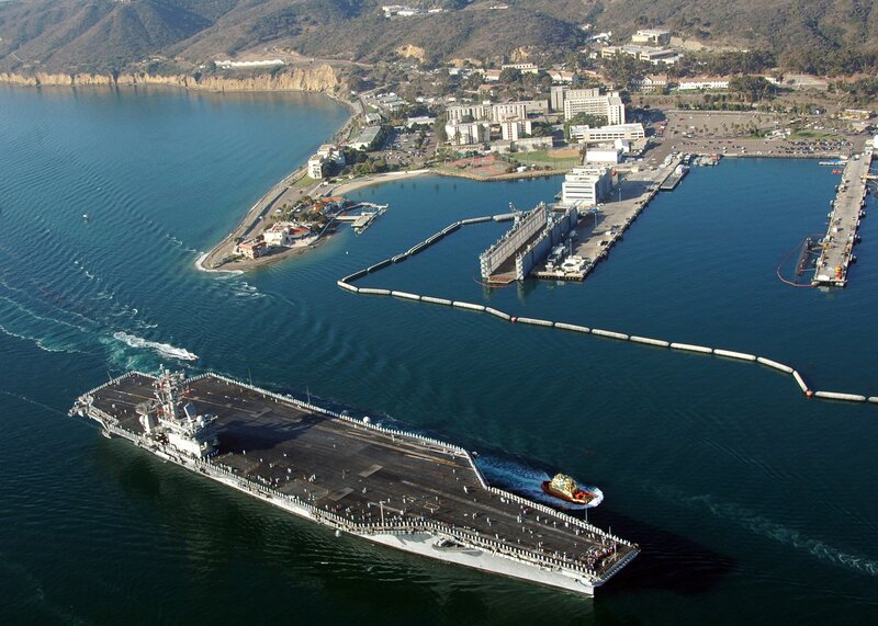 Aircraft Carrier in Harbor — Blue, Calm, Afternoon