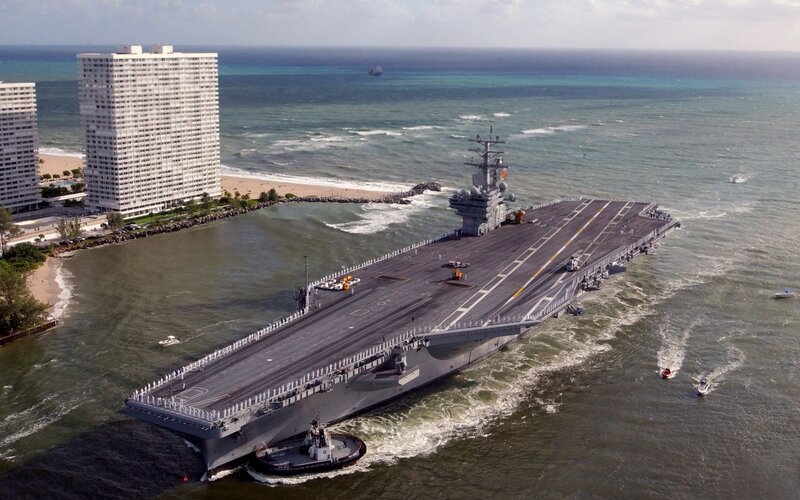 Aircraft carrier near a city
