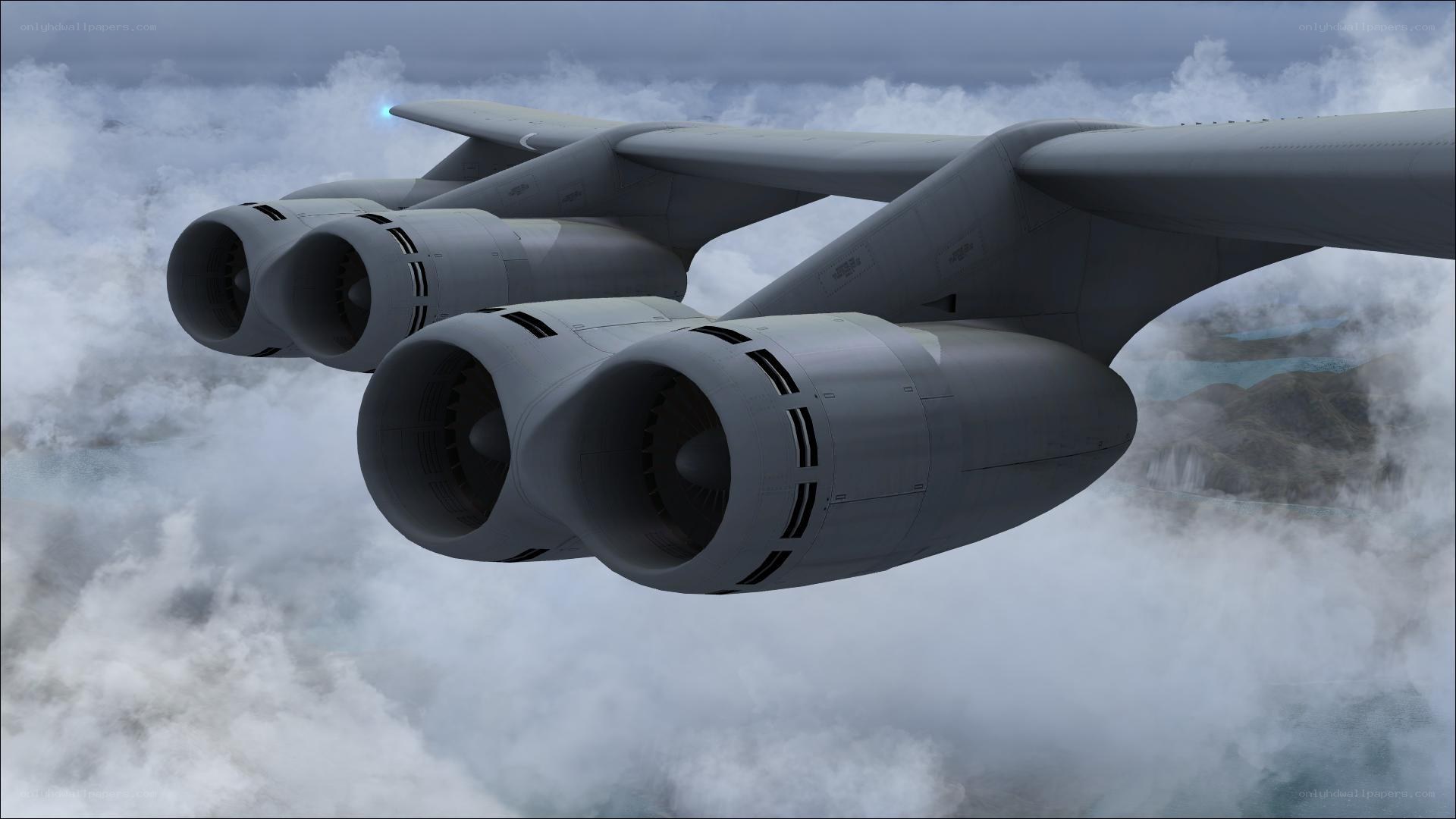 aircraft flying above clouds