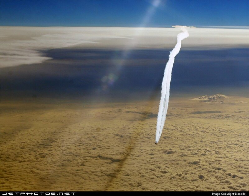 Aircraft Flying Above Clouds — Blue