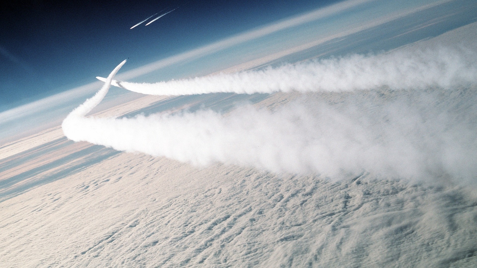 Aircraft flying over clouds