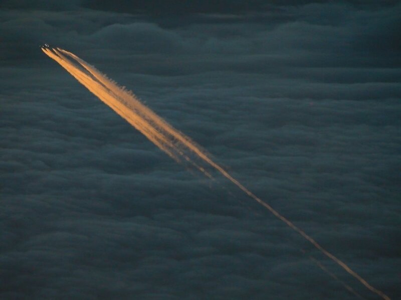 Aircraft flying over clouds