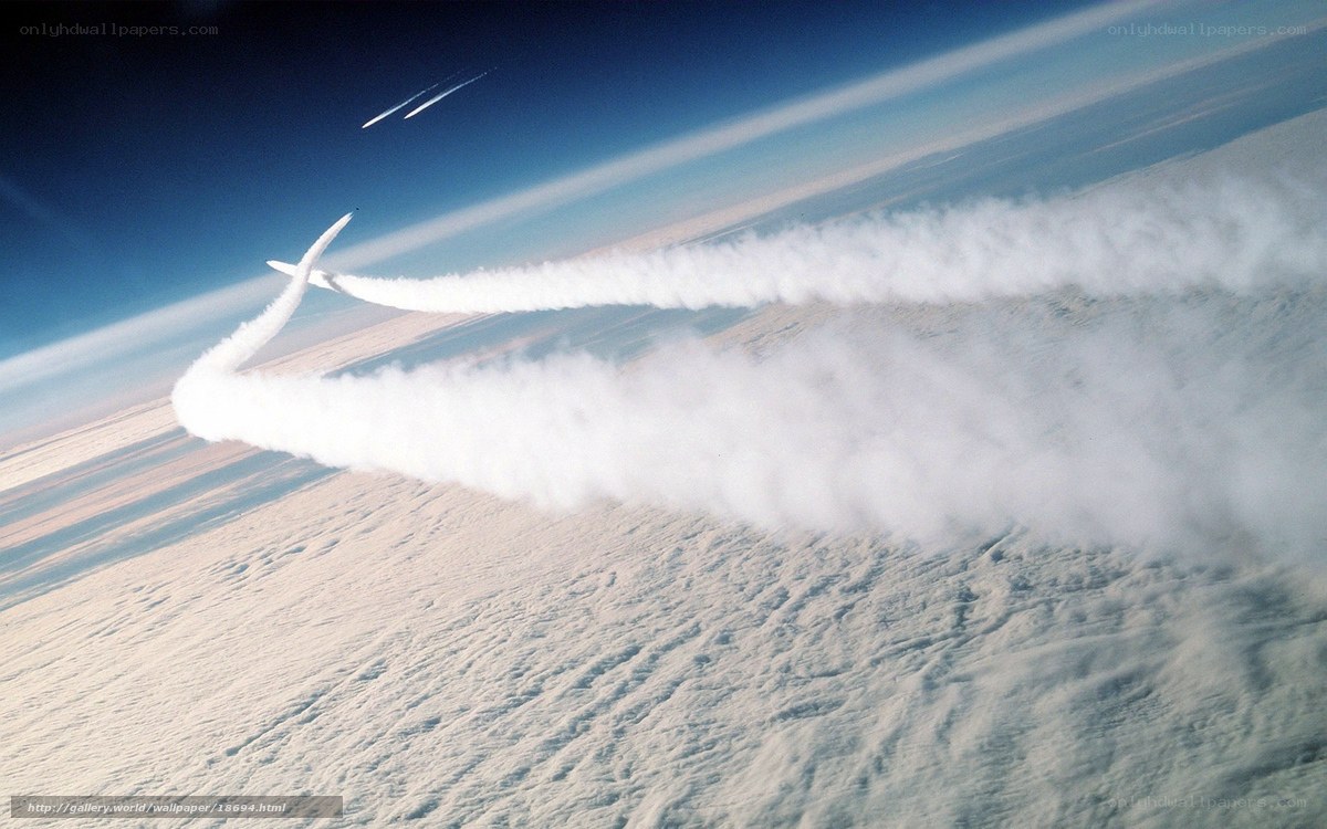 Aircraft flying over clouds