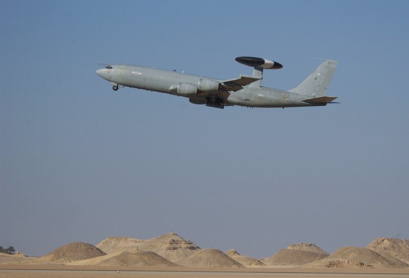 Aircraft flying over desert