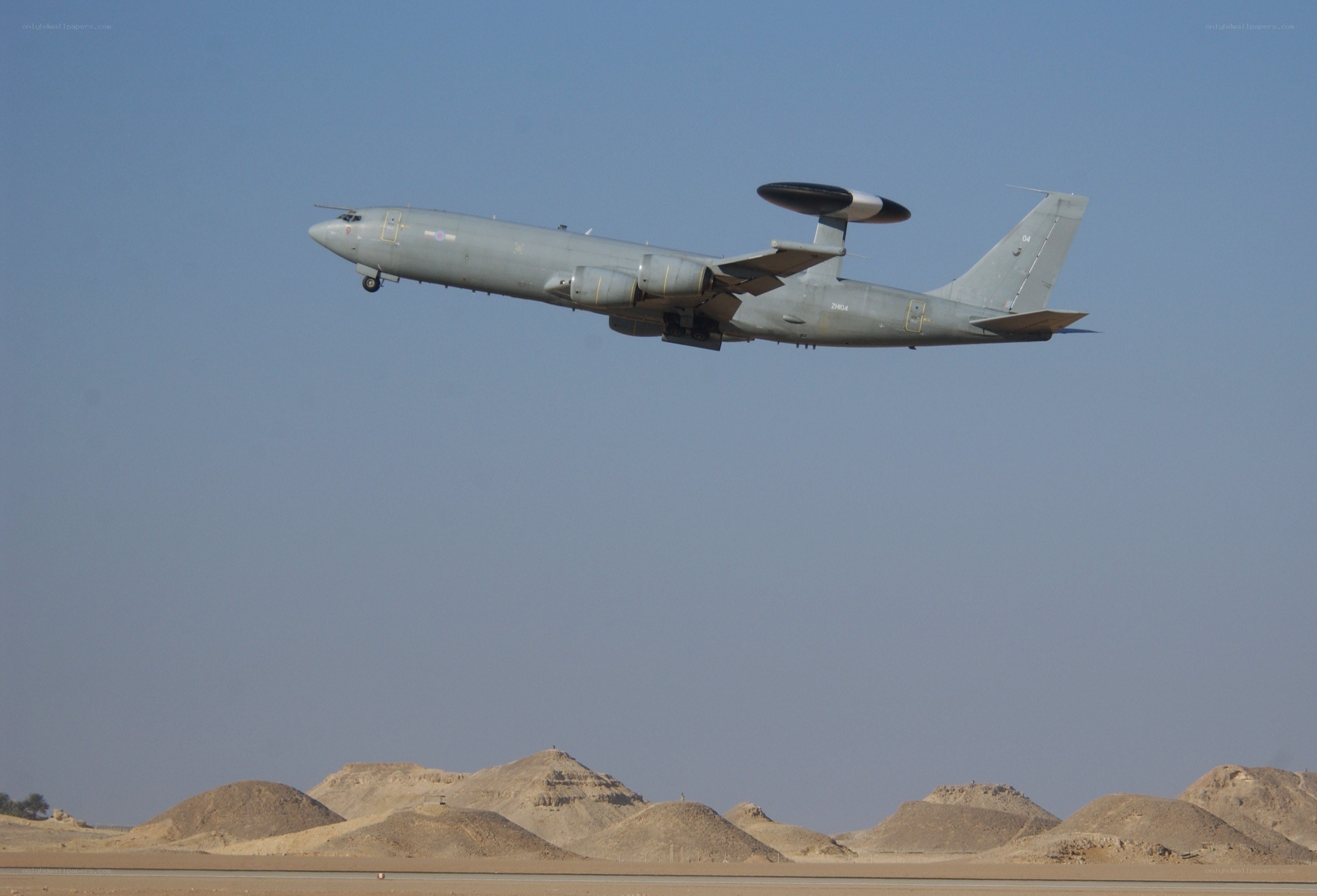 Aircraft flying over desert