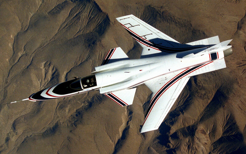 aircraft flying over desert