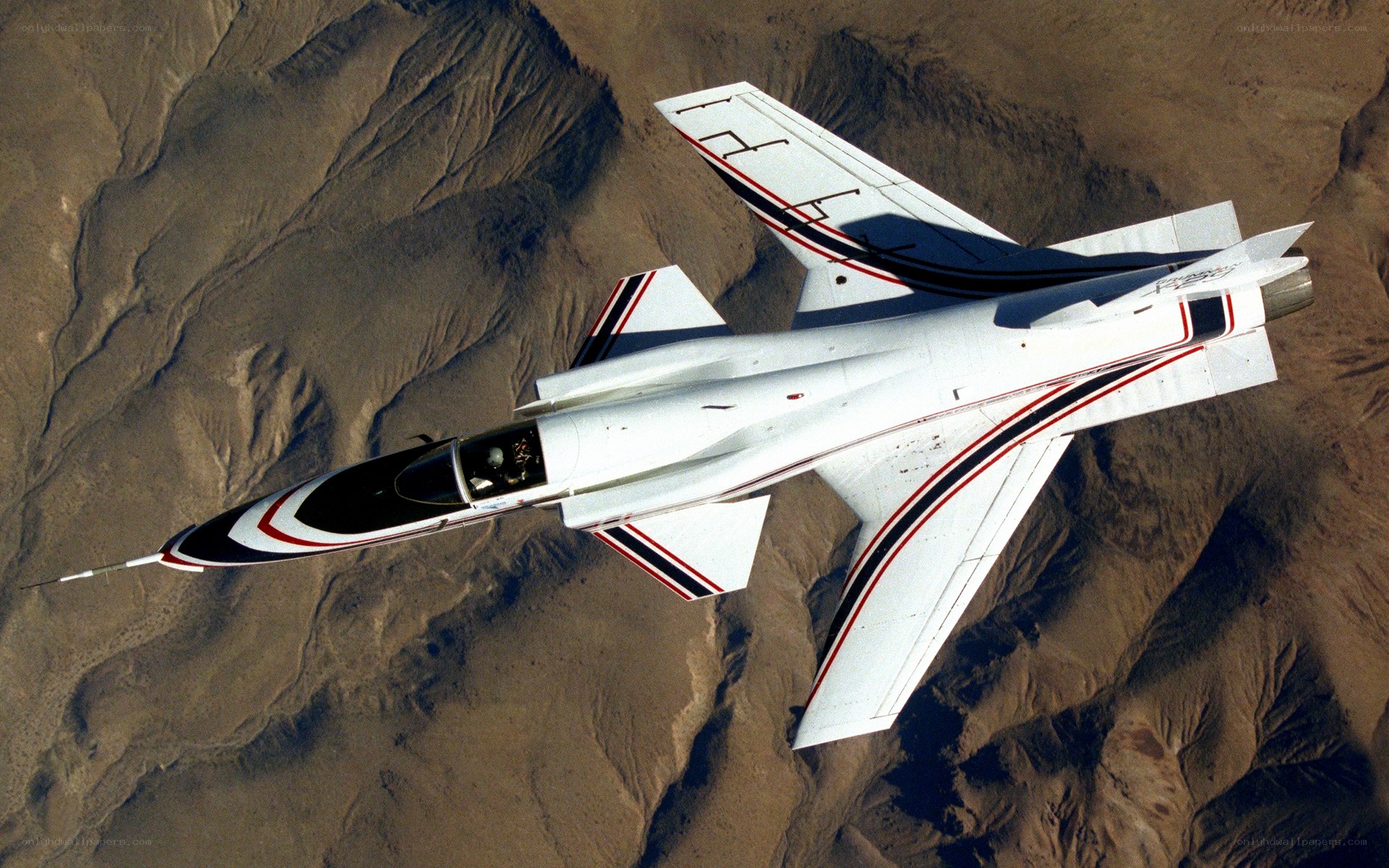 aircraft flying over desert