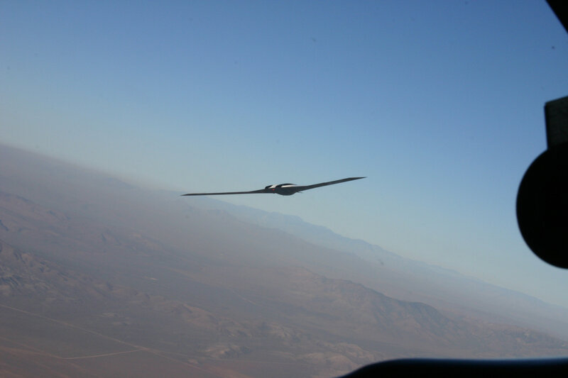 aircraft flying over mountains