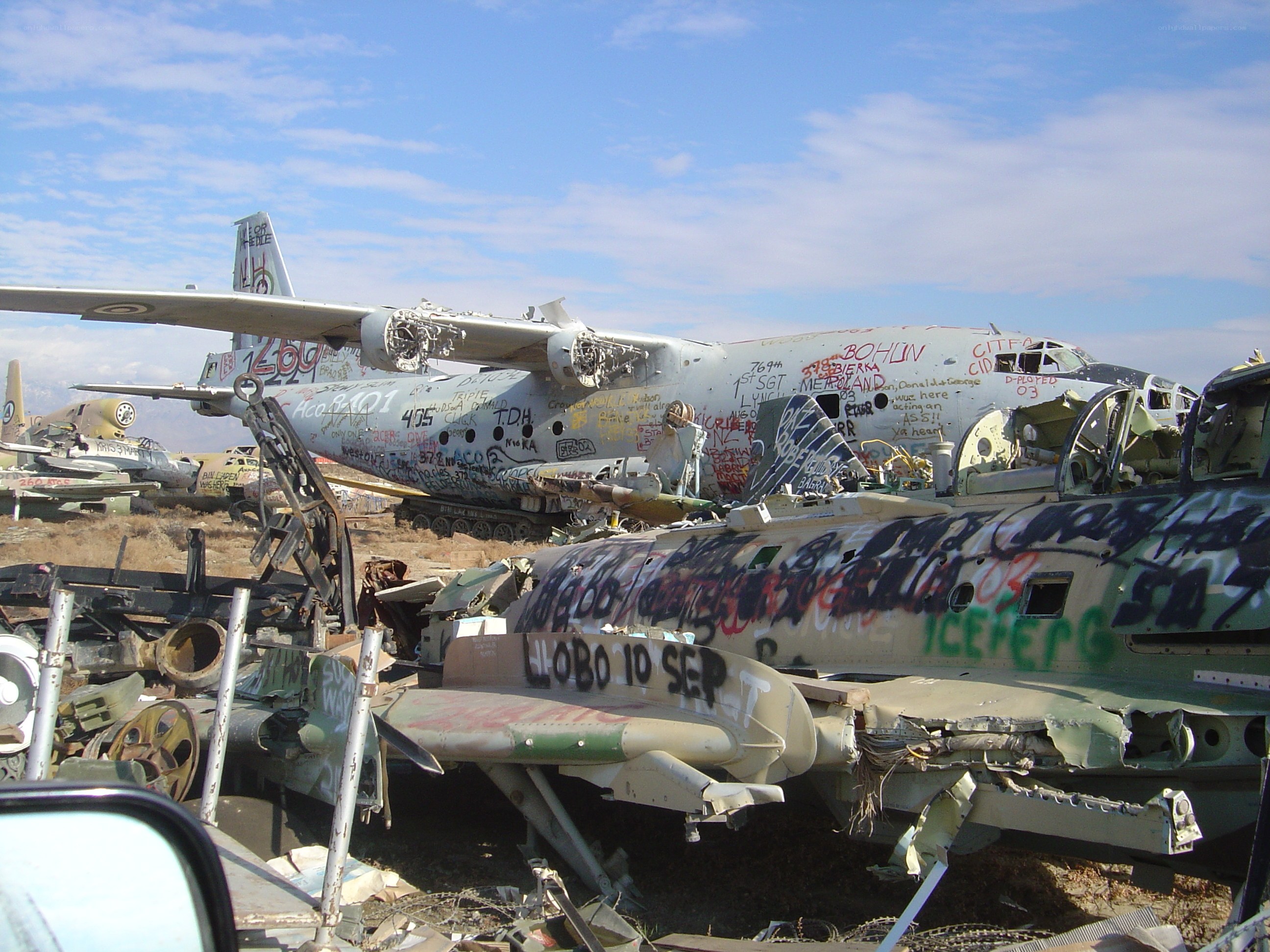 aircraft graveyard with graffiti