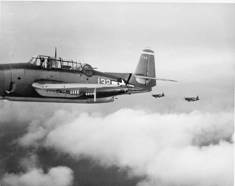 Aircraft in flight over clouds