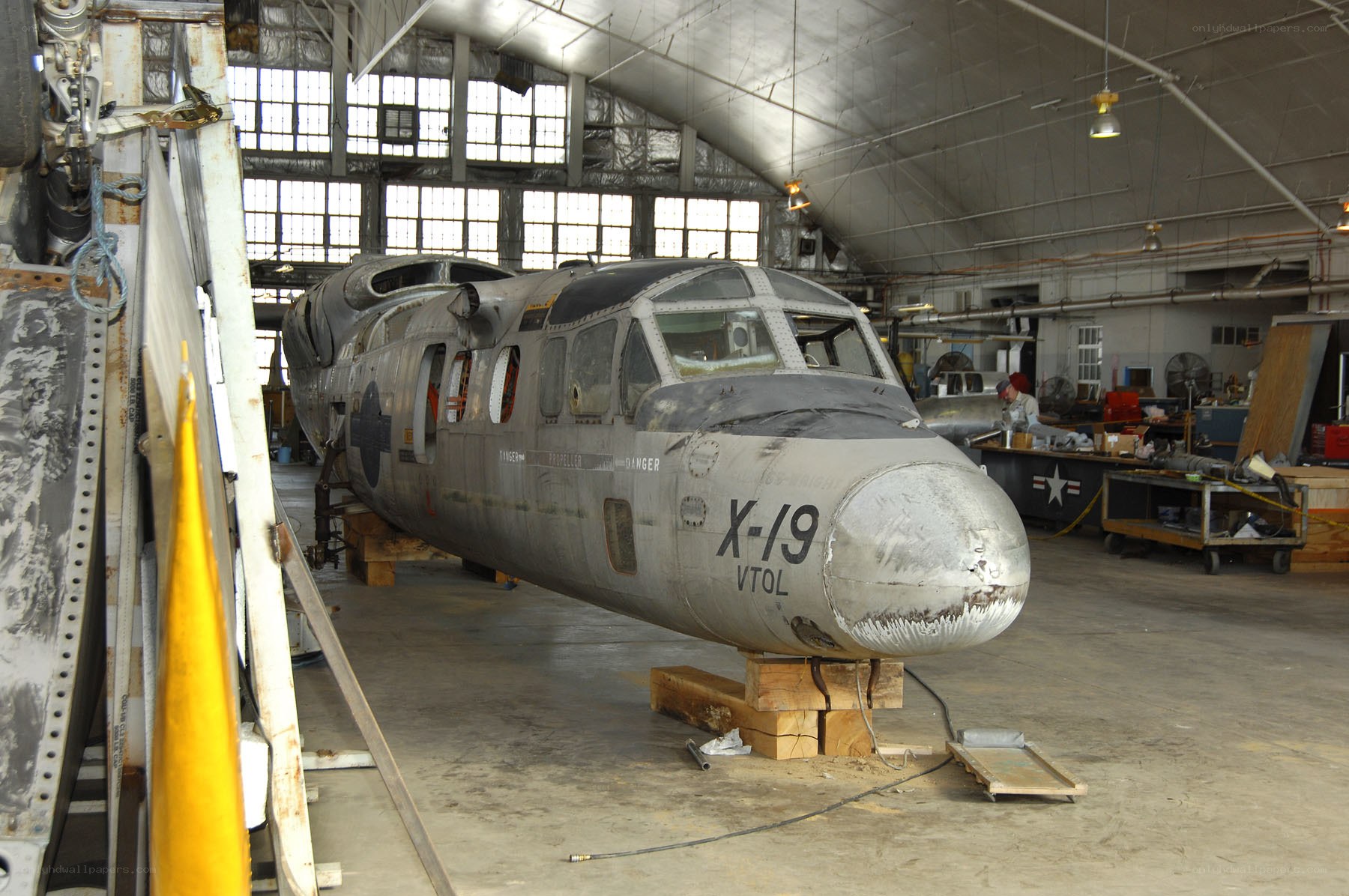 aircraft in hangar undergoing maintenance