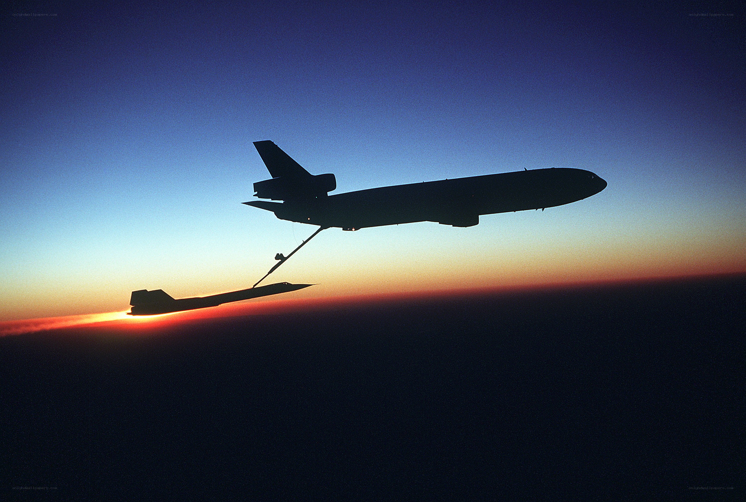 Aircraft refueling in silhouette