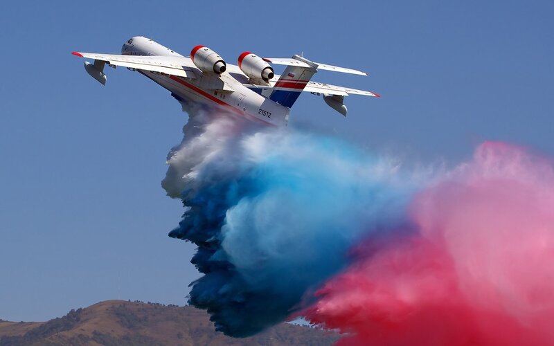 Aircraft Releasing Colored Smoke — Blue