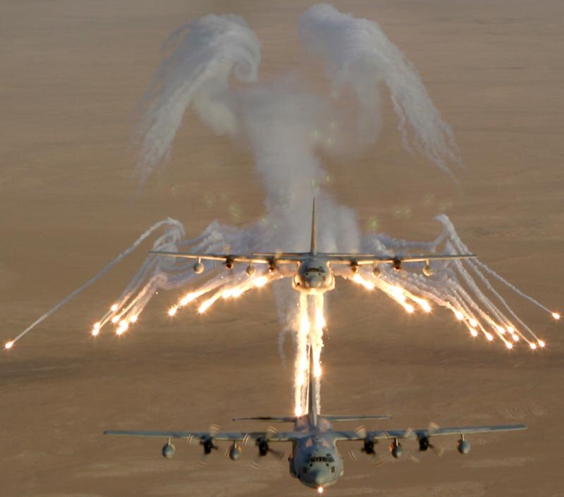 Aircraft releasing flares in formation