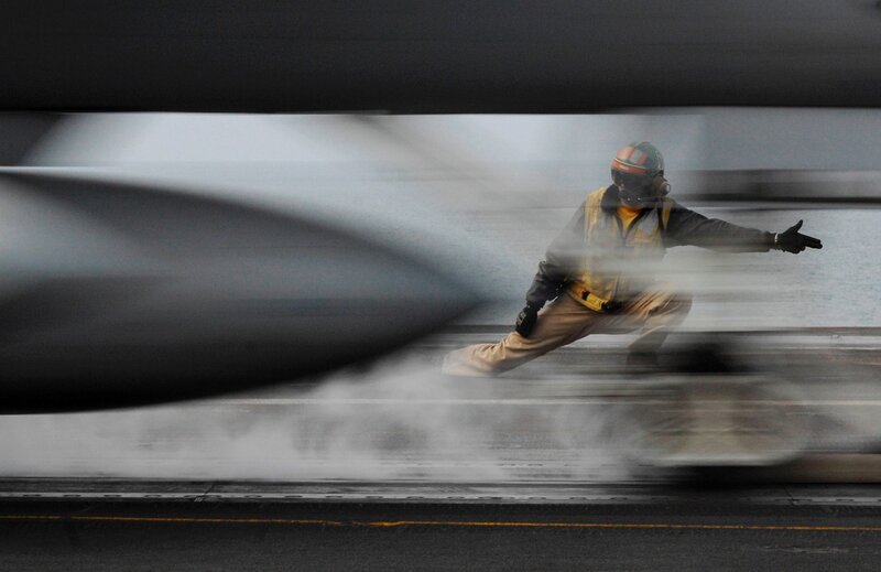 Aircrew member on aircraft carrier deck