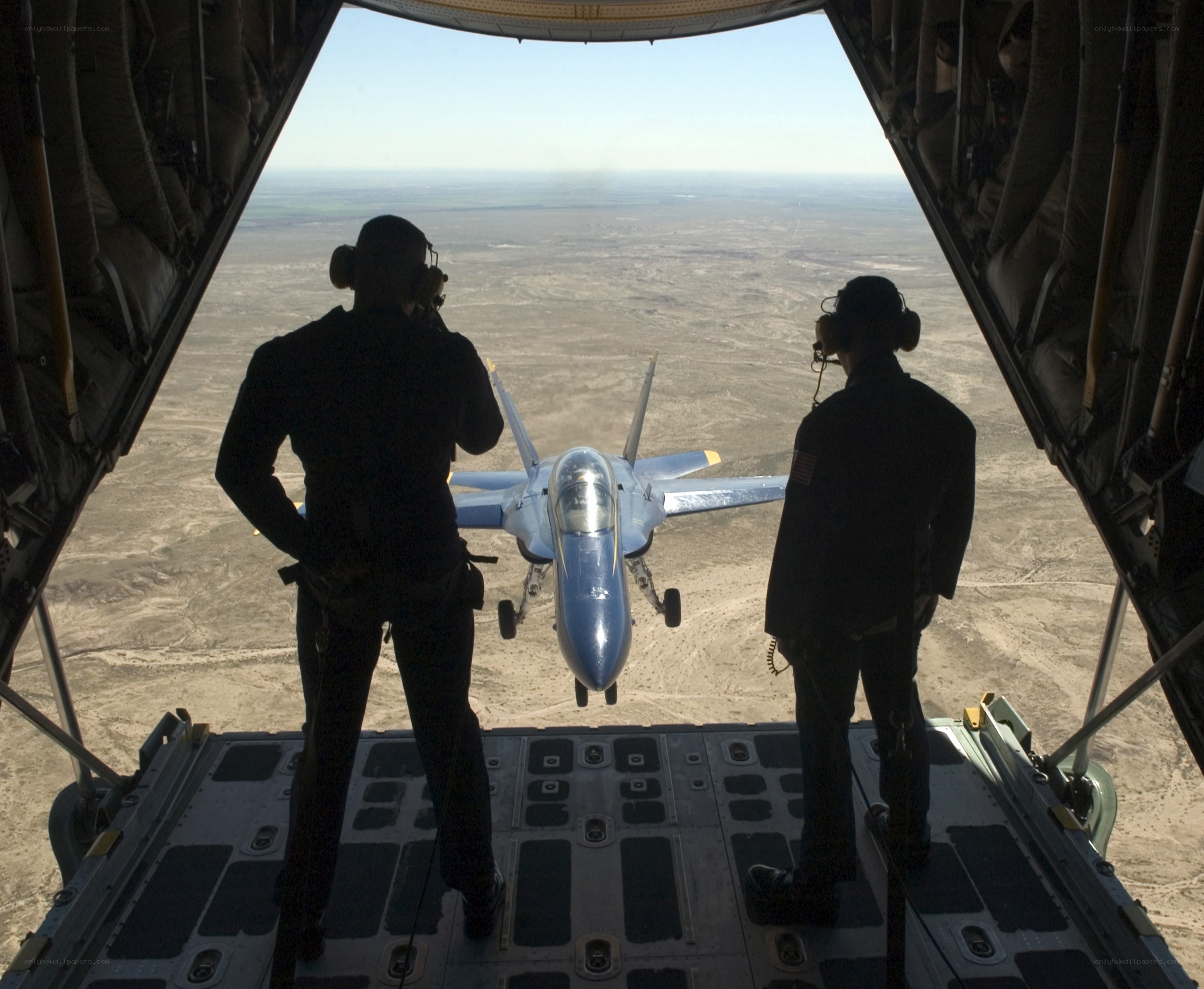 Aircrew observing jet in flight