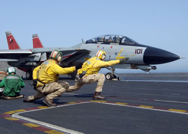 Aircrew on aircraft carrier deck
