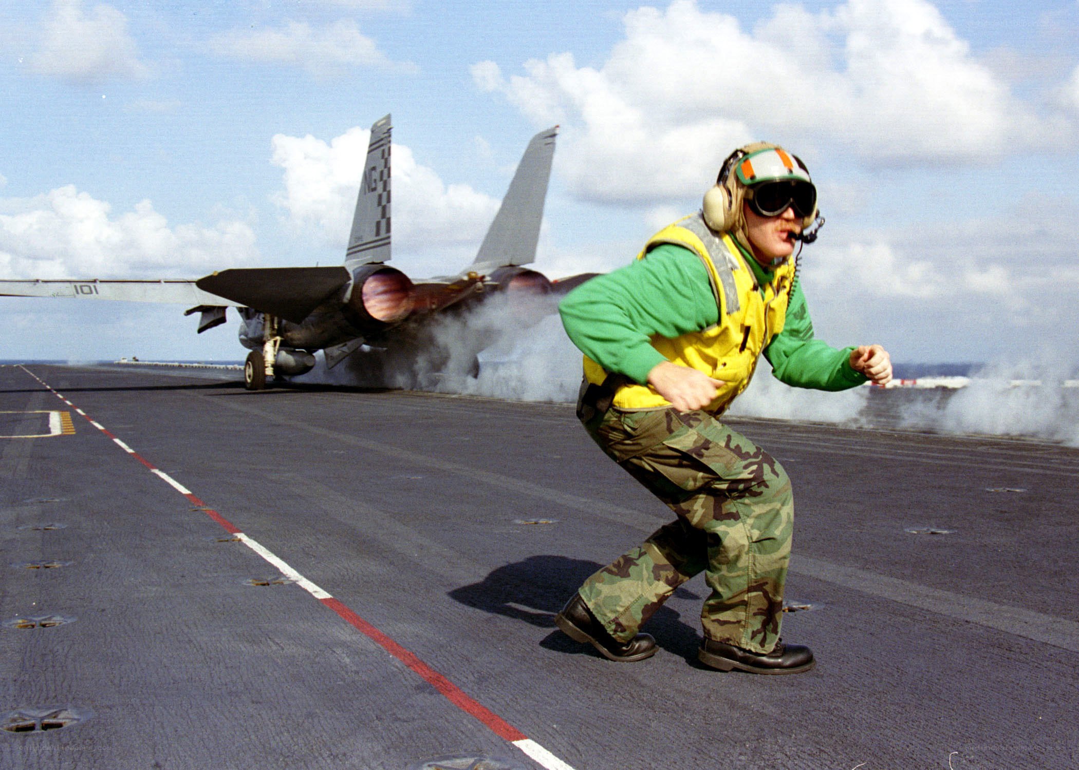 Aircrew on aircraft carrier deck